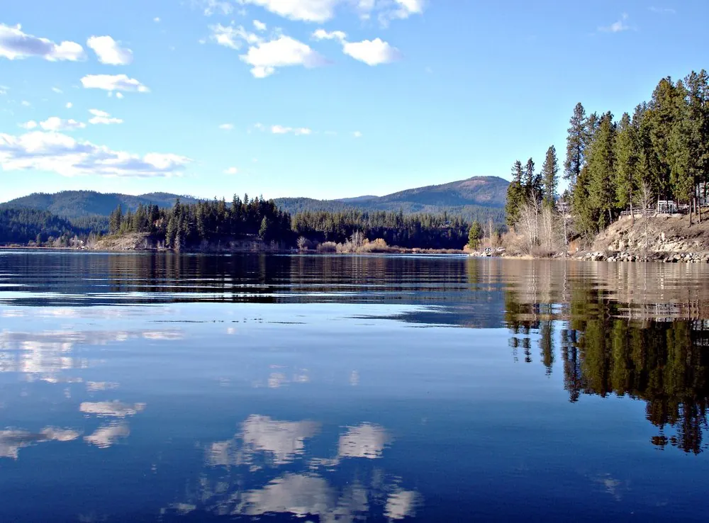 Hauser Lake Idaho calm water reflection mountains